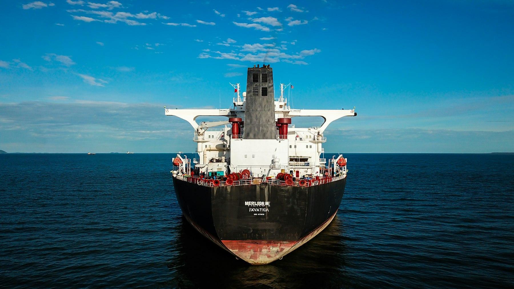 Laden crude oil tanker viewed head-on at sea
